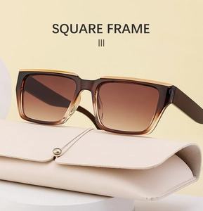 Detail view of square gradient brown sunglasses with metal trim and a protective case