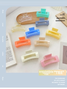 Detailed view of colorful rectangular hollow hair claws in various candy tones