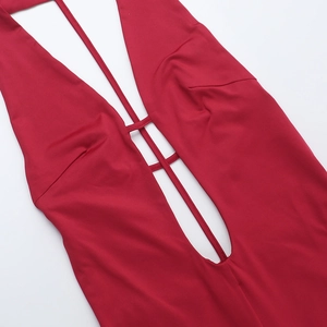 Close-up of sexy deep V-neck and lace-up cutout details on a burgundy bodysuit