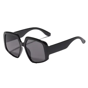Oversized black square sunglasses for women with UV protection in a vintage minimalist style