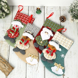 Set of 4 linen Christmas stockings featuring 3D Santa, Snowman, Deer and Bear characters