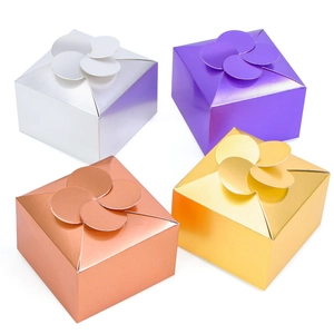 Detailed view of square gift boxes in metallic silver, purple, rose gold and gold colors