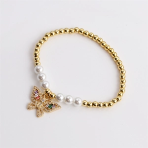 Elegant gold beads and pearl bracelet featuring a colorful rhinestone butterfly charm