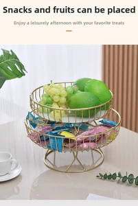 Detail of a two-tier golden metal snack stand with realistic marble texture trays