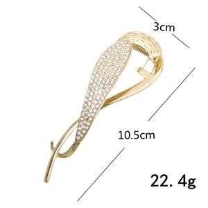 Golden hair clip with pearls and rhinestones measuring 10.5cm and weighing 22.4g