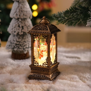 Close-up of vintage bronze Christmas lantern with LED snowmen and sparkling snow