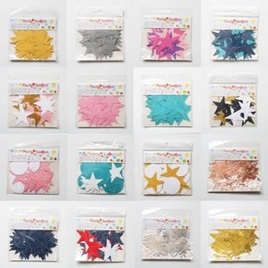 Detail view of 16 packs of mixed color star and round paper confetti for party decor