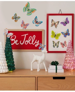 Detailed view of colorful PVC butterfly wall stickers on a festive holiday background