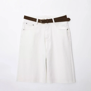 White high-waisted denim wide-leg shorts with a vintage dark brown belt in flat lay view