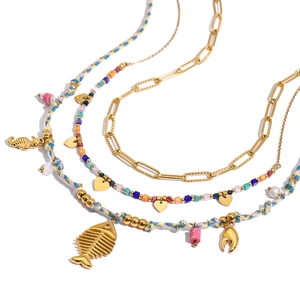 Layered gold titanium steel necklace with colorful beads and seaside animal charms