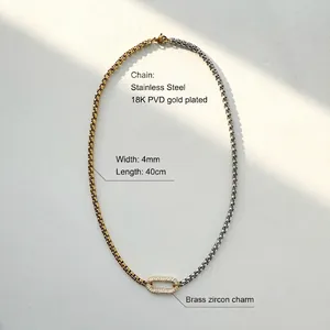 Macro shot of two-tone box chain with crystal oval pendant and 18K PVD gold plating