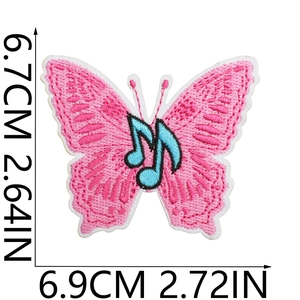 Detailed view of pink butterfly embroidery patch with blue musical notes and dimensions