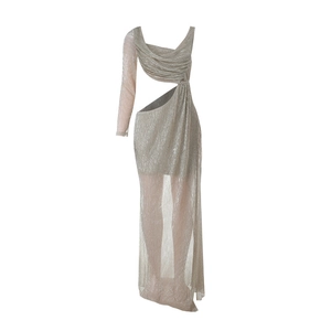 Close-up of sparkling fabric texture with waist cutout and side slit on cocktail dress