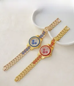 Macro detail of luxury gold quartz watch with full crystal pavé and colorful bezel accents