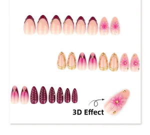 Détails de fleurs 3D et motif style français sur faux ongles bordeaux et roses