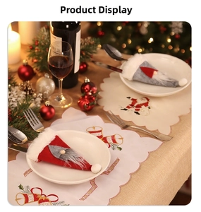 Festive Christmas table setting with gnome cutlery holders and holiday themed placemats