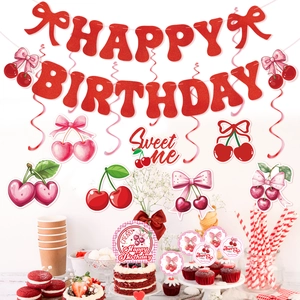 Close-up of glittery red cherry Happy Birthday banner and cake toppers for party
