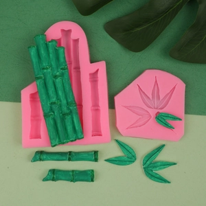 Detailed pink silicone mold set for bamboo and leaf shapes with green fondant finished results