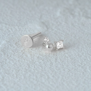 Close-up of S925 silver earring featuring a pearl and zircon stones with flat-back stud