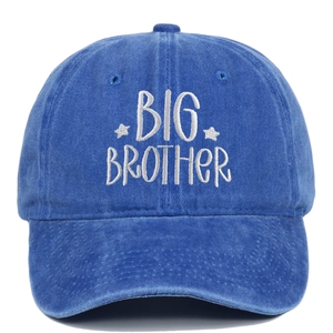 Detail of Big Brother embroidery on blue washed cotton baseball cap with white stars