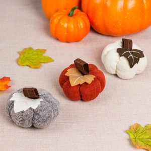 Knitted pumpkin ornaments in grey, burgundy and white for autumn harvest home decor