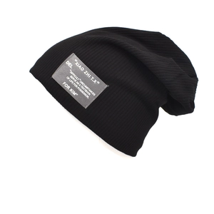 Casual black knitted slouchy beanie with stylish fabric patch for autumn and winter warmth