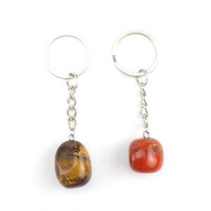 Tiger eye and red jasper natural stone keychains with stainless steel rings on white