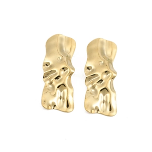 Golden irregular liquid lava heart studs with textured wavy metal for modern earrings