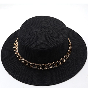 Top view of a black woven boater hat featuring a decorative thick gold chain on the crown