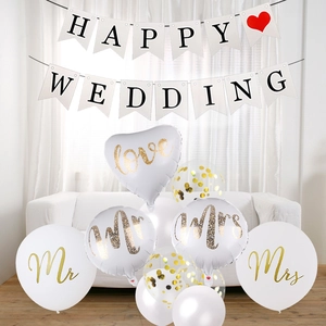 Wedding decoration set with Happy Wedding banner and gold Mr & Mrs balloons on sofa