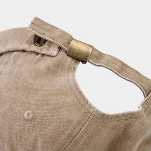 Detailed view of khaki washed cotton docker hat with adjustable antique brass buckle
