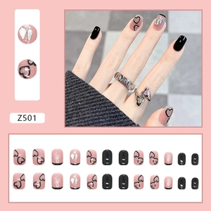 Glittery black and pink press-on nails set with silver heart patterns and rhinestones