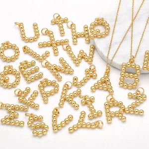 Polished gold plated A-Z letter pendant necklaces with beaded design and fine chains