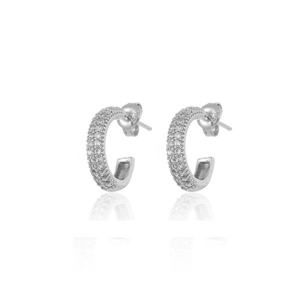 Detail of silver S925 earrings featuring sparkling cubic zirconia in C-shape design