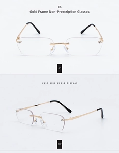 Detail view of rimless gold metal eyeglasses with clear lenses and black temple tips