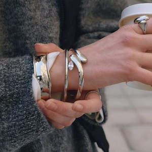 Polished stainless steel zircon bangles and stackable rings for women in a street style