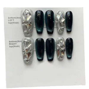 Handmade deep green cat eye press-on nails with silver glitter and 3D gemstone accents