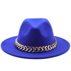 Detail of royal blue wool fedora hat featuring a stylish wide gold link metal chain band