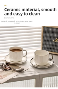 Close-up of luxury white ceramic coffee cups with elegant silver metallic trim and saucers