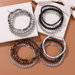 Detail of multi-layer natural stone bracelets with tiger eye and stainless steel chains