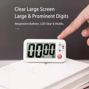 Digital kitchen timer with large LCD screen and magnetic back on minimalist white books