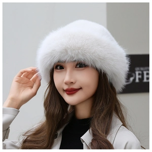 Detail view of the thick white faux fur texture and soft fluffy finish on the winter hat