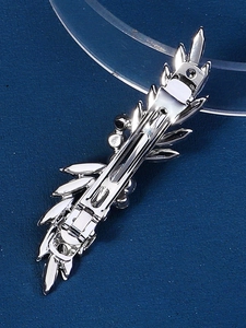 Detailed back view of a silver spring hair clip with a metallic leaf-shaped design