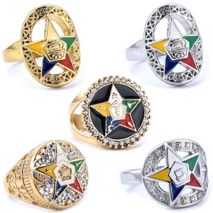Detail of OES star rings featuring colorful enamel inlays and gold-tone finish set