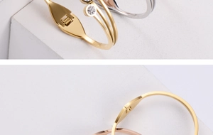 Detail of fashion steel bracelet showing the flexible spring hinge and rhinestone accents