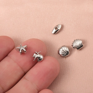 Zilveren roestvrijstalen oceaanbedeltjes met zeester en octopus voor doe-het-zelf sieraden