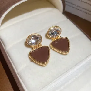 Elegant 18k gold plated triangle drop earrings with cubic zirconia in a velvet jewelry box