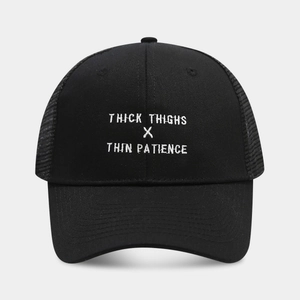 Detail of black trucker hat with white embroidered Thick Thighs Thin Patience text