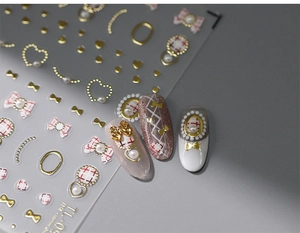 Detailed 3D nail art stickers featuring golden bows, pearls, and red plaid patterns