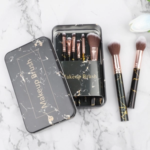8-piece marble makeup brush set with rose gold ferrules and a portable travel metal box